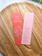 Two bookmarks with double-sided illustrations, one in red and one in pink, with text and a floral design on each.