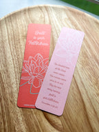 Two bookmarks with double-sided illustrations, Lily floral illustration, one in red and one in pink, with text and a floral design on each.