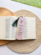  bookmark with one having a green floral pattern and the other a beige grennery design, both with text on them, placed in a clear poly sleeve.