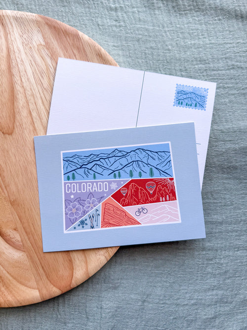 Colorado Postcard design with illustrations inside about the state on a wooden surface