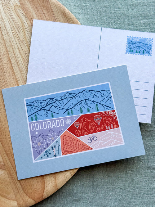 Colorado Postcard design with illustrations inside about the state on a wooden surface