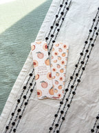 Christian bookmark featuring peach illustrations on a textured fabric surface. verse Psalm 150:6