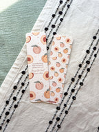 Two patterned bookmarks with peach designs on a textured surface. bible verse psalm 150:6