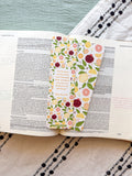 Citrus fruit pattern bookmark with tassel on an open book with verse Ephesians 2:8