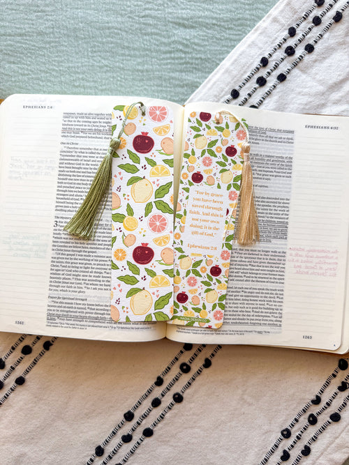 Citrus fruit pattern bookmark with tassel on an open book