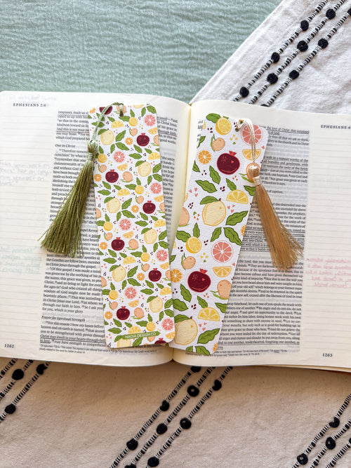 citrus patterned bookmarks with tassels on an open book