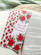 poinsettia Floral Christian bookmark with text" Jesus is the reason for the season" on a textured surface