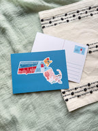 Postcard with a Massachusetts illustrated design on a textured surface