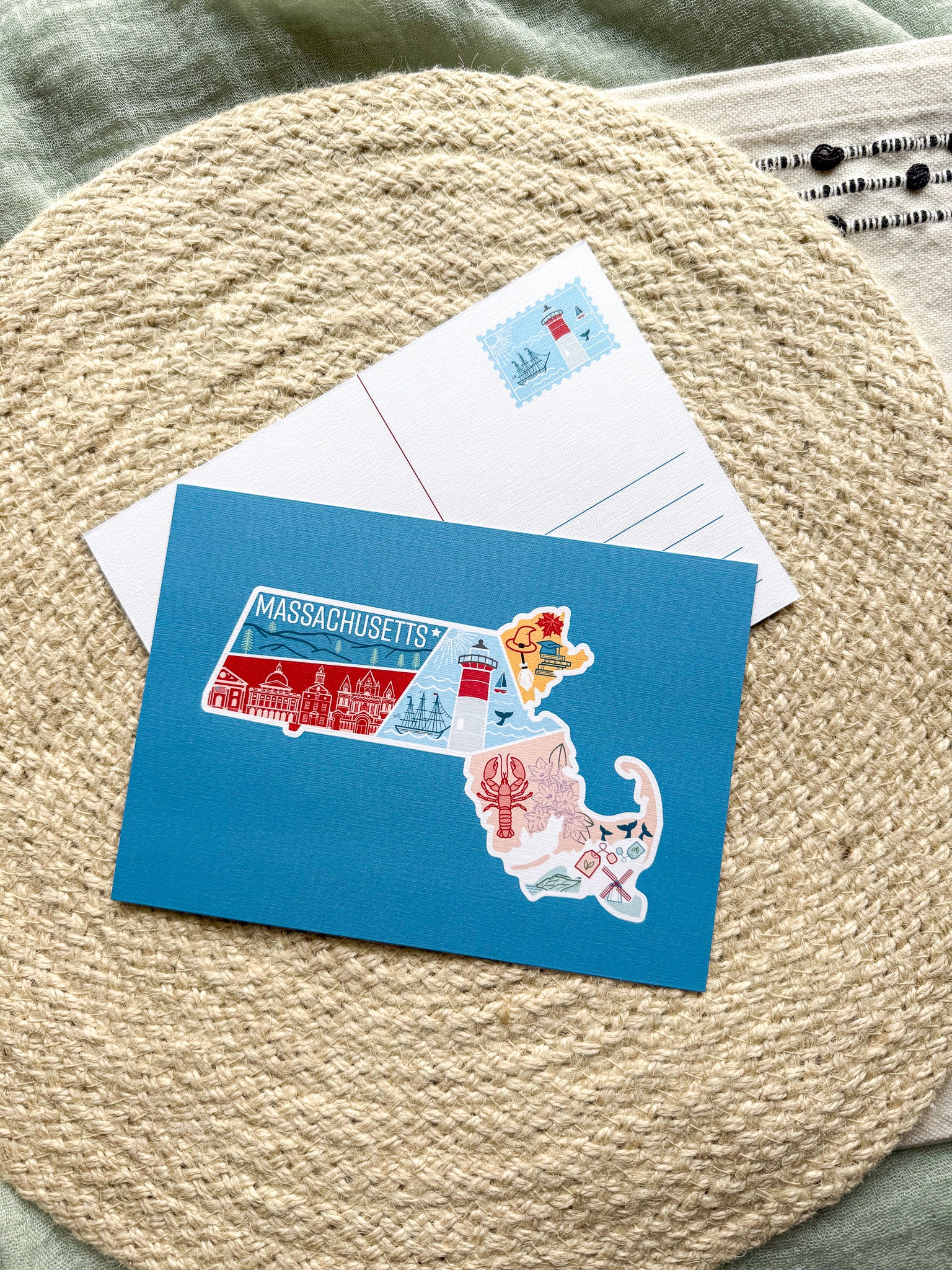 Postcard with a Massachusetts illustrated design on a textured surface