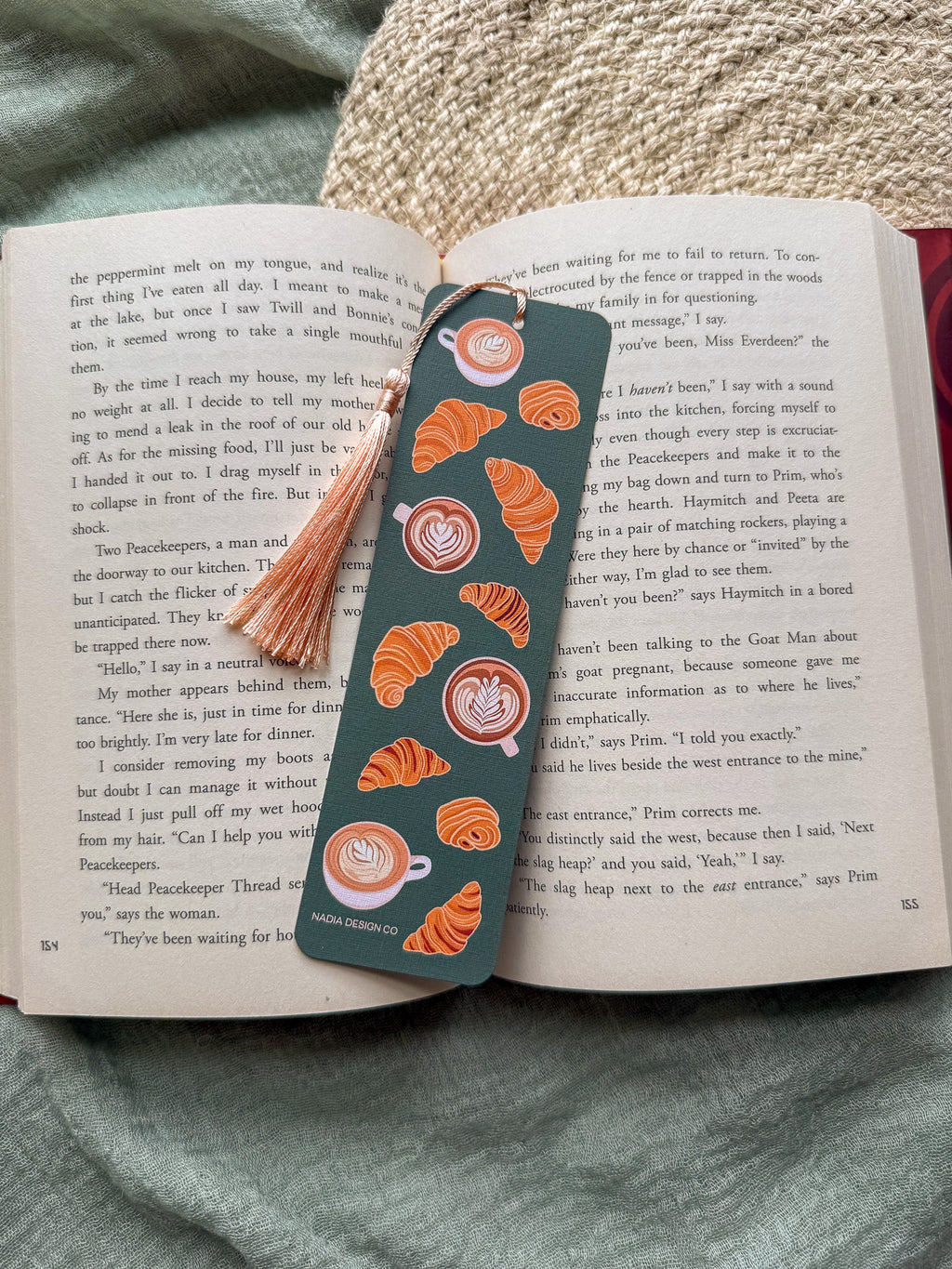 Bookmark with croissant and latte coffee cup designs with tassel and an open book
