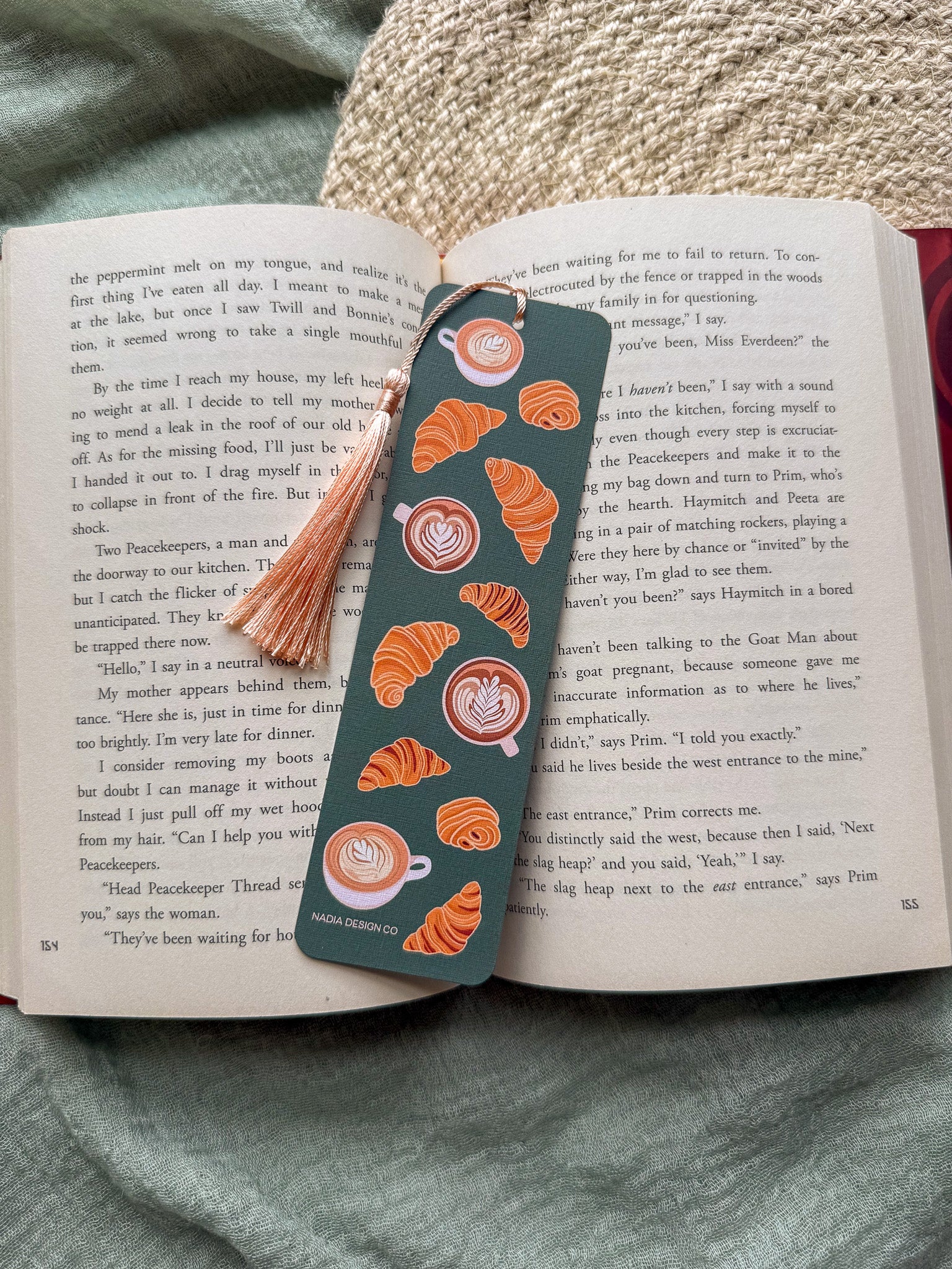Bookmark with croissant and latte coffee cup designs with tassel and an open book