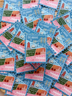 Stickers of Delaware with landmarks on a blue background