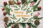 Merry christmas card that is illustrated with greery leaves 