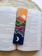 Bookmark with mountain design on an open book