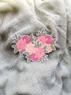 Peony Floral sticker with pink flowers on a textured gray fabric background