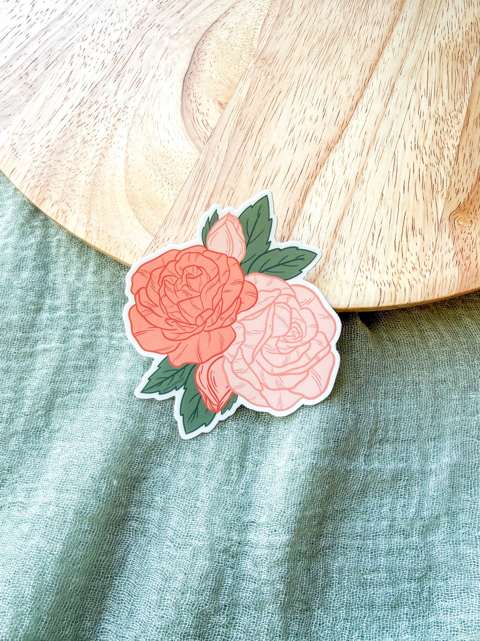 Roses Floral sticker with pink and red roses on a wooden surface