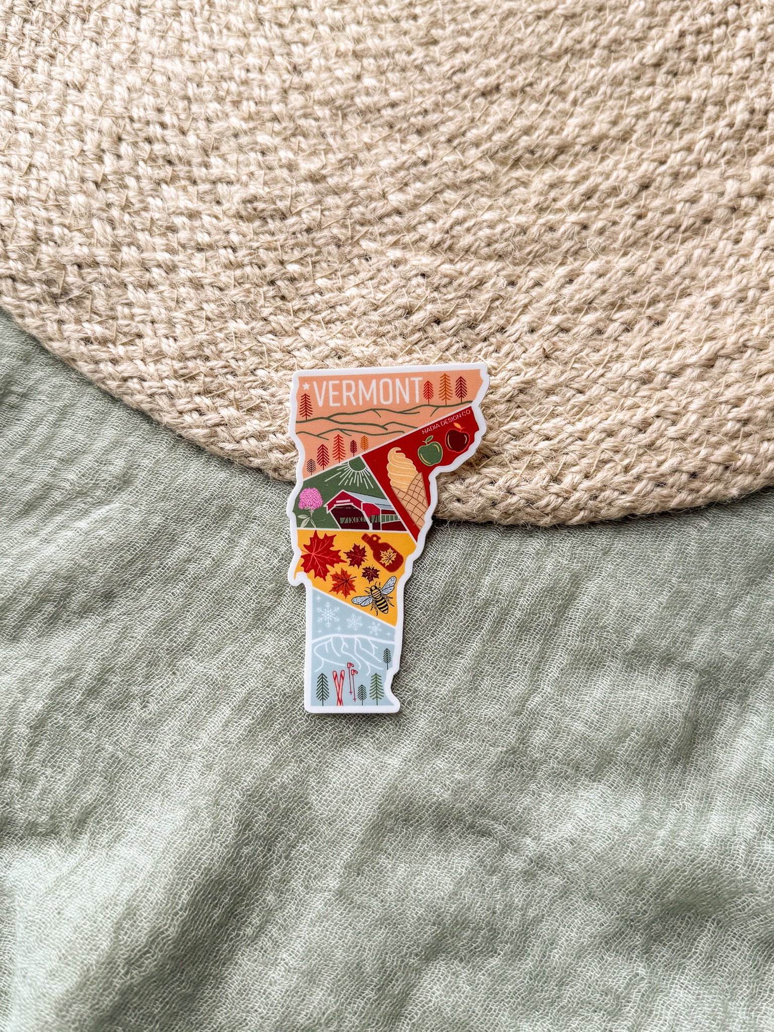 Sticker of Vermont on a textured surface
