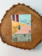 A colorful postcard featuring an illustration of California's landscape, including mountains, a beach, and iconic symbols like palm trees and a sailboat.