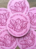 A set of pink vinyl stickers with a floral design and the text 'TRUST IN THE LORD WITH ALL YOUR HEART' written on them.