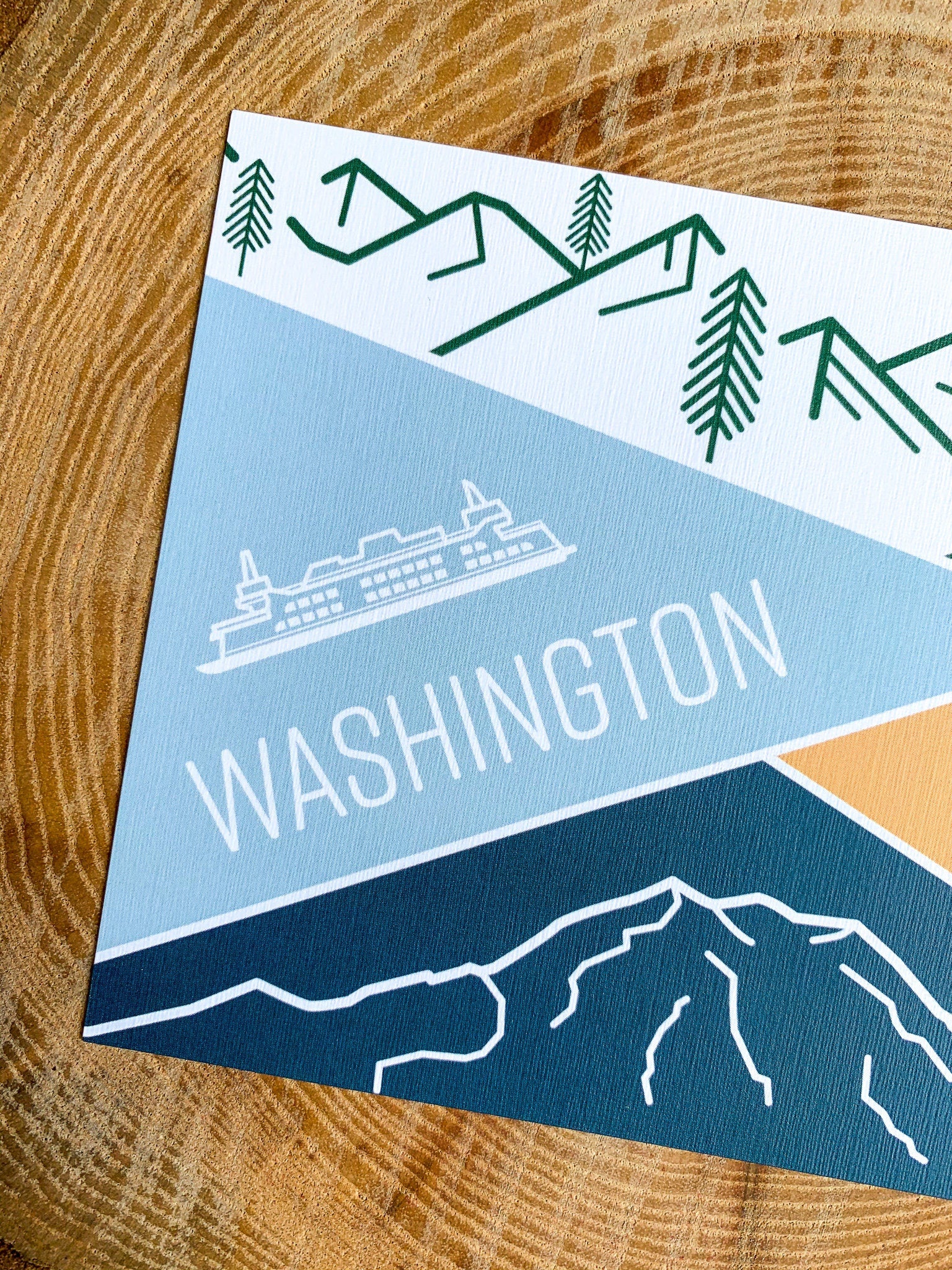 A postcard featuring illustrated landscapes and iconic symbols of Washington state, including mountains and the Seattle Space Needle.